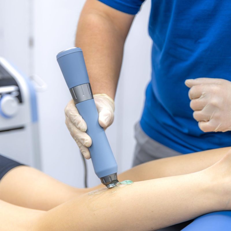 physiotherapist-performs-ultrasound-therapy-female-patient-knee-joint-rehabilitation-scaled.jpg